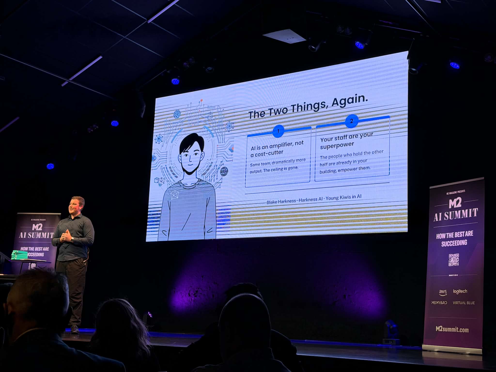 Blake Harkness speaking on stage at the M2 AI Summit in Christchurch